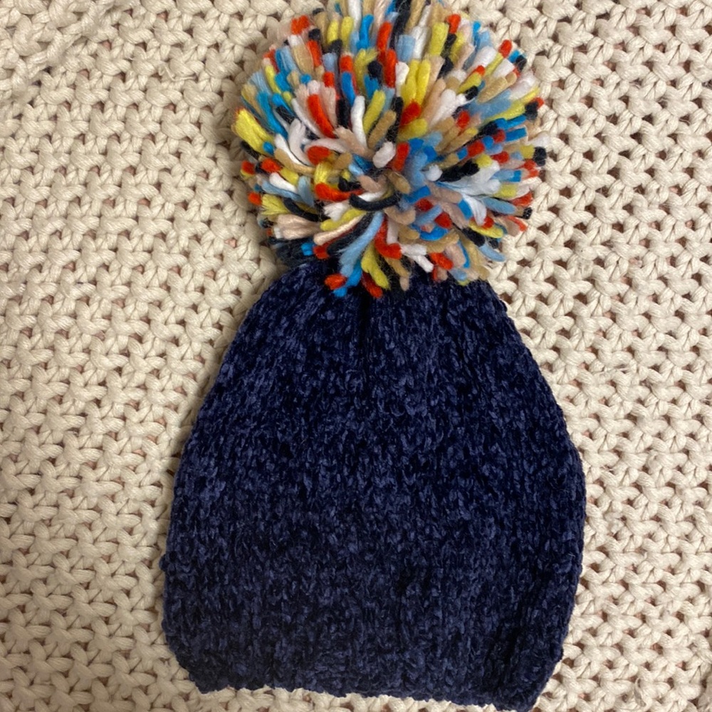 Navy blue winter beanie hat with colorful Pom Pom